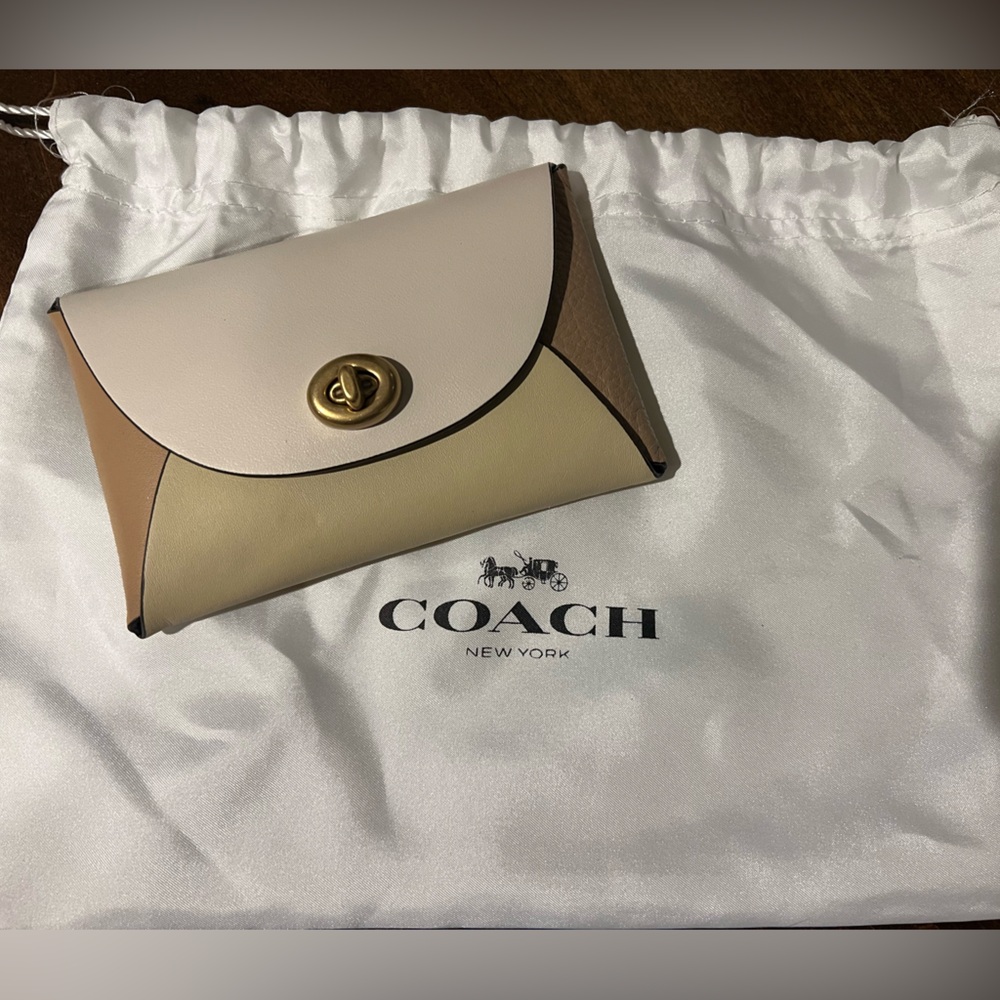 Never used, Coach (Re)Loved Medium color block pouch in beige